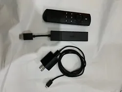 Fire Stick with HDMI adapter and plug. Color is Black.