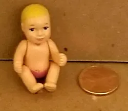 Pregnant Midge newborn baby girl doll. with blonde hair, blue around the eyes, and a pink diaper. dated 2002. Happy...