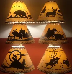 Faux leather oiled paper lamp shades with lacing top and bottom and a wrap-around rustic scene. 14
