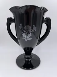 Ebony Two handled Daisy Vase. Measures 8” tall, 7” across incl. handles4.25” at baseChip on handle (see photo)