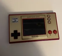 Nintendo Super Mario Bros Game and Watch, a commemorative item for the 35th anniversary. Uses a USB-C cable to charge.