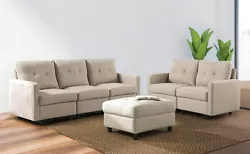 This couch is made from engineered wood and stands on black block legs. It’s upholstered in neutral-colored...