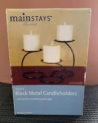 The holders have been displayed with candles but none have been burned in them. There are light marks from where the...