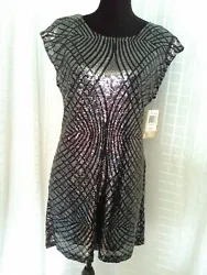 STUNNING dress in size small. This sexy dress with a v cut back, very impressive no matter the occasion. This dress in...