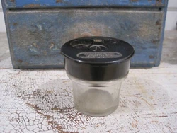 CIRCA 1930S, OLD INK WELL FROM A SCHOOL DESK WHEN CHILDREN USED PENS DIPPED IN INK
