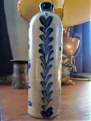 Beautiful cobalt decoration. The cork is stuck in the bottle and it appears there is wax there as well?. Uncommon form.