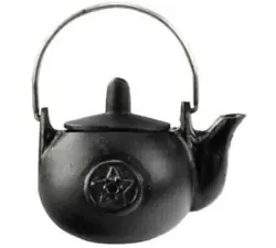A miniature cast iron tea kettle with a raised pentacle on the side. 3