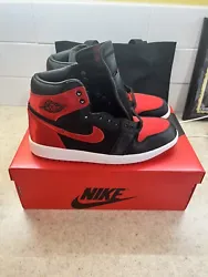 Get ready to step up your sneaker game with the Air Jordan 1 Retro High OG Satin Bred 2023. The sleek design features a...