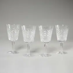 A beautiful set of four (4) Waterford cut crystal water goblet glasses in the 