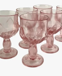 These beautiful glasses were very popular back in the 1970s. The glasses are a deep pink and heavy in weight.