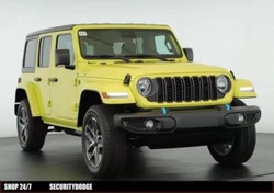 This ALL NEW 2024 Jeep Wrangler Sport 4xe features high velocity exterior and black cloth seats. This highlights the...