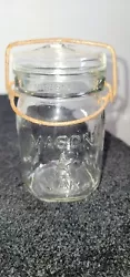 This 1 Pint Mason Jar With An Embossed Star K 1874 7 On Bottom is a piece of history that deserves a spot in your...