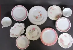 This set includes 15 German made dishes that are part of a set they include - 5 Saucers with roses around the outer...