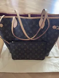 Authentic Louis Vuitton Monogram Neverfull size MM in excellent condition. Interior color fuchsia/peony/hot pink with...