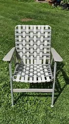 Vintage Folding Lawn Chair Mid Sixtys Original Webbing. Tin Arms with Vinyl covering. Still has Folding Instructions....