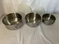 Set of 3 Farberware Stainless Steel Nesting Mixing Bowls with two plastic covers for the largest and smallest bowls....