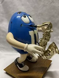 IBlue M&M With Saxaphone . Condition is Used. No cracks found may be a little dusty or discolored from storing. Has...