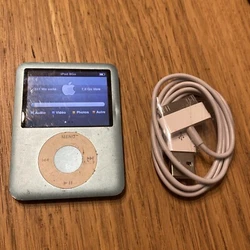 Apple Ipod Nano 3ème Génération 8goFonctionne bien Câble générique neuf Des traces et rayures sur l’écran et...