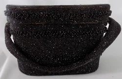 It is in very good condition. It has a flat handle that looks folded in the middle where it would have been held. There...