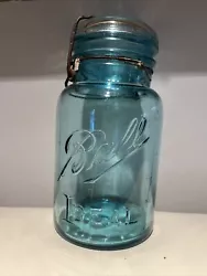 Ideal #4 Ball jar. 7” tall. In good condition. No chips or breaks. The wire rim is rusted. See photos