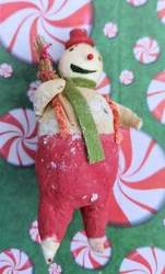 Mr. (or Ms.) Snowman is made of a lightweight material (seems to be paper mache). and is whimsically dressed in...