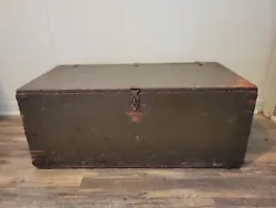 Original flat top wooden footlocker. Inside is stamped with date of 1951. Original Army green paint. Piece sits flat...