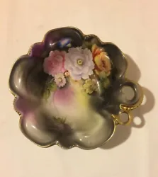 Hand painted flowers, gold trim on rim of bowl. Bowl is in good condition with one chip on the back side of rim.