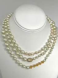Lovely, quality necklace, with lots of versatility. Faux and fresh water pearls accented with amber-colored crystals.