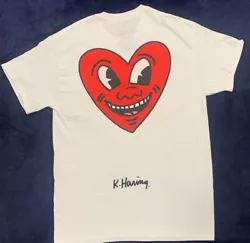 Bring a fresh twist to your daily look with the new Keith Haring Heart T-Shirt. This chill tee features a crew...