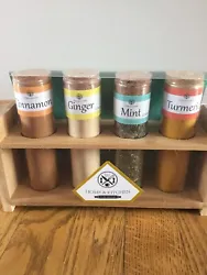 Wooden Spice Rack With 4 Jars Of Spices(NEW). Contains Cinnamon, Ginger, Mint, & Turmeric. Condition is New. Shipped...