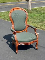 Antique Victorian Upholstered Mahogany Parlor Chair c.1880 having graceful carvings around the kidney shaped back,...