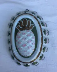 PINEAPPLE DESIGN, HAS HOOK FOR HANGING. CERAMIC MOLD FOR WALL DECOR. HAND PAINTED FROM HOLLAND.
