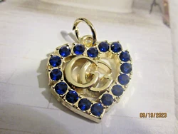 1 GUCCI HEART CHARM. WITH BLUE COLOR RHINESTONES.