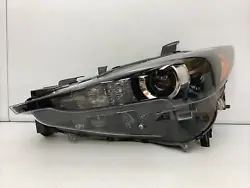 Up for sale is a good working part. It is a right driver side headlight. This is a genuine authentic OEM MAZDA part....