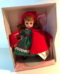 Beautiful little doll in perfect condition - never removed from box.