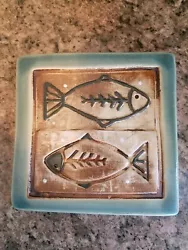 Fantastic art studio tile, with a cool fish design. Measures about 5.5 in. square and is in wonderful condition! Stamp...