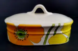 Wild Poppy Butter Dish LID. Small dark marks inside the lid from. kiln firing. White background with Yellow and.