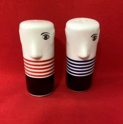 Whimsical salt and pepper shaker set in the style of Pablo Picasso.