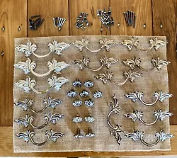 For your consideration we have a box lot of 15 French Provincial drawer handles and 11 knobs. As for the handles, there...