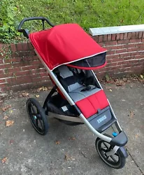 Thule Urban Glide stroller – red. Bought for marathon training with my youngest and I loved going on runs with him in...