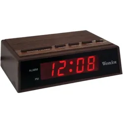 Westclox LED Digital Alarm Clock. Plastic Casing with Wood Grain Finish. Electric snooze alarm with battery backup....