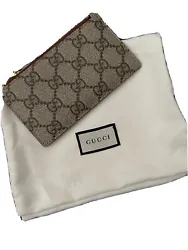 Gucci Zip Card - GG Supreme Brown. Vintage and rare item.This wallet is pre owned and have wear. There are scratches...