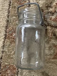 VINTAGE SMALL CANNING JAR WITH WIRE BAIL, And Lid has K 1779 4 on Bottom. Nice shape. See photos for detailed...