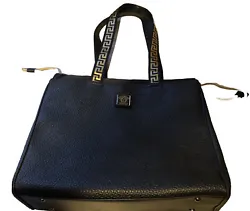 The bag is accentuated with exotic leather handles and gold hardware, adding a touch of luxury to your overall look.
