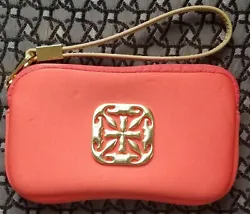 There are scratch marks on the gold Rustic Cuff logo hardware on front. Otherwise, the wristlet is in good condition.