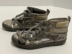 Girls size 13 high top sneakers. Has signs of wear along shoes. Includes scuffs on multiple parts of both shoes ( see...