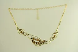 Material: BROWN AMBER RHINESTONE. Form: LINK NECKLACE.