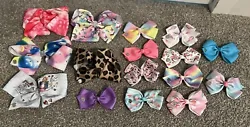Add a touch of Jojo Siwas style to your little girls hair with this lot of 16 authentic JoJo bows. Each bow features a...