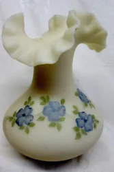 The vase has a ruffled top and stands about 7 1/4