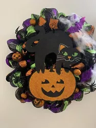 • This is a Brand new Halloween Mesh Wreath. I used a very pretty Black ,orange and deco mesh on a wire frame. I...